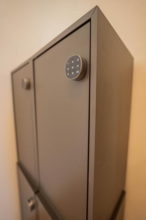 a door with a button on top of it at Drunken Monkey Hostel in Prague