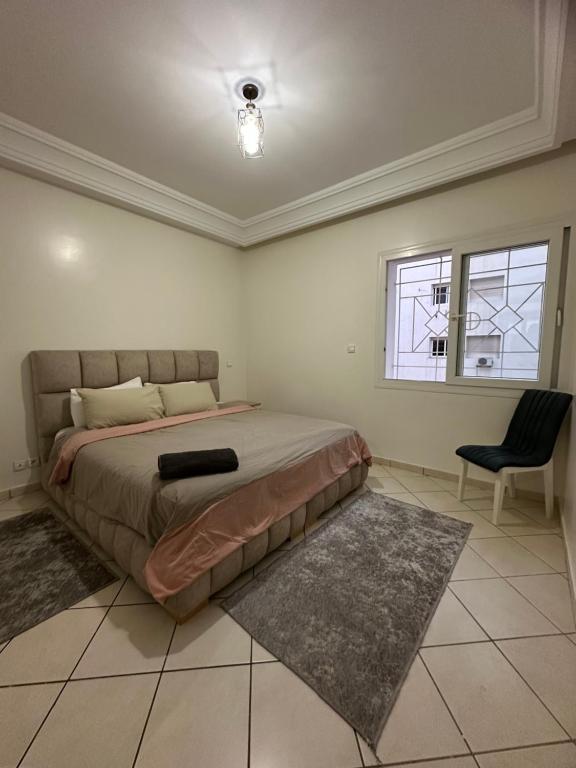 Postel nebo postele na pokoji v ubytování Aprt au centre ville Agadir