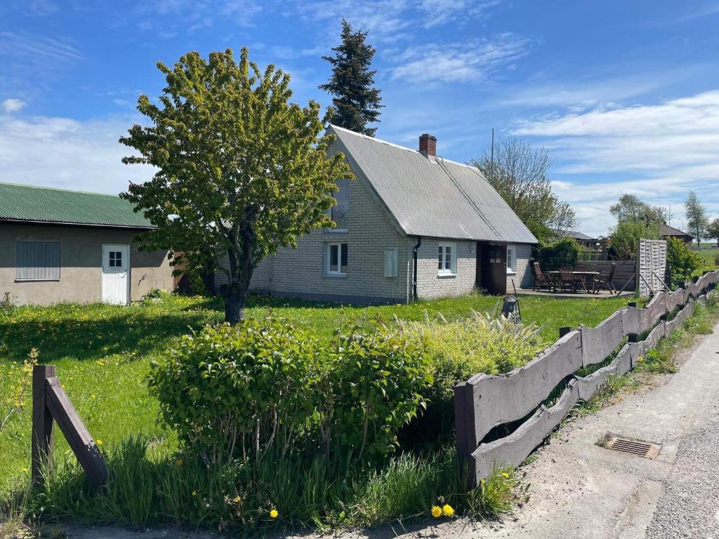 a house with a fence in front of a yard at 4 person holiday home in ESLÖV in Eslöv