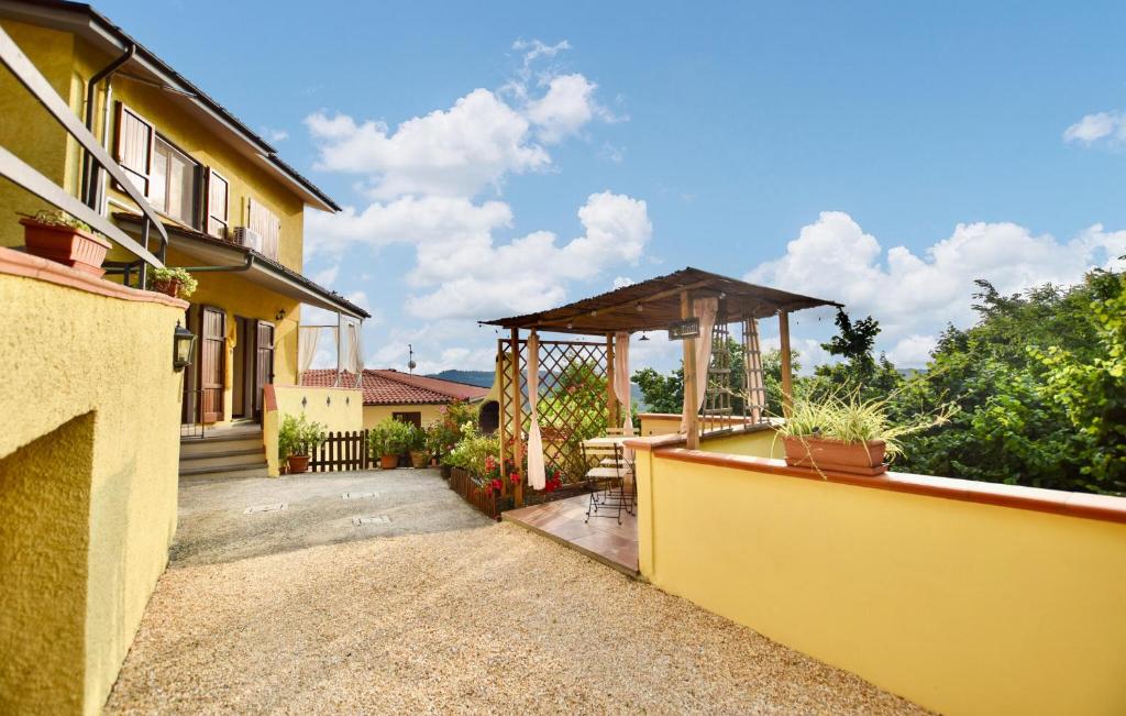 a backyard with a gazebo and a house at 3 Bedroom Cozy Home In Camaiore in Camaiore