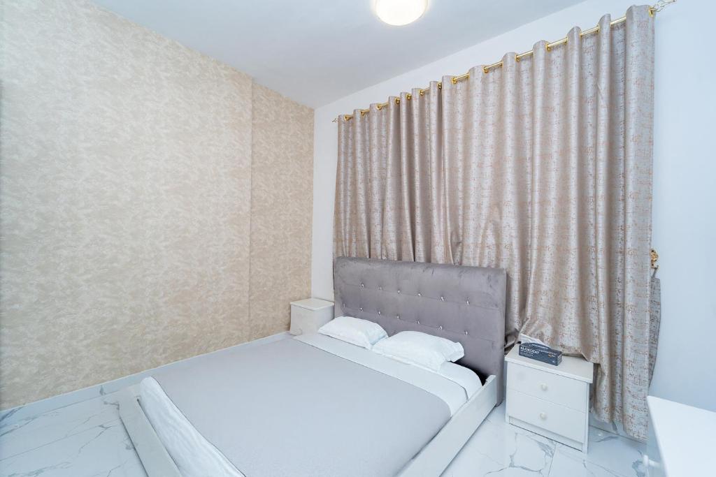 Postel nebo postele na pokoji v ubytování Oasis Tower 1