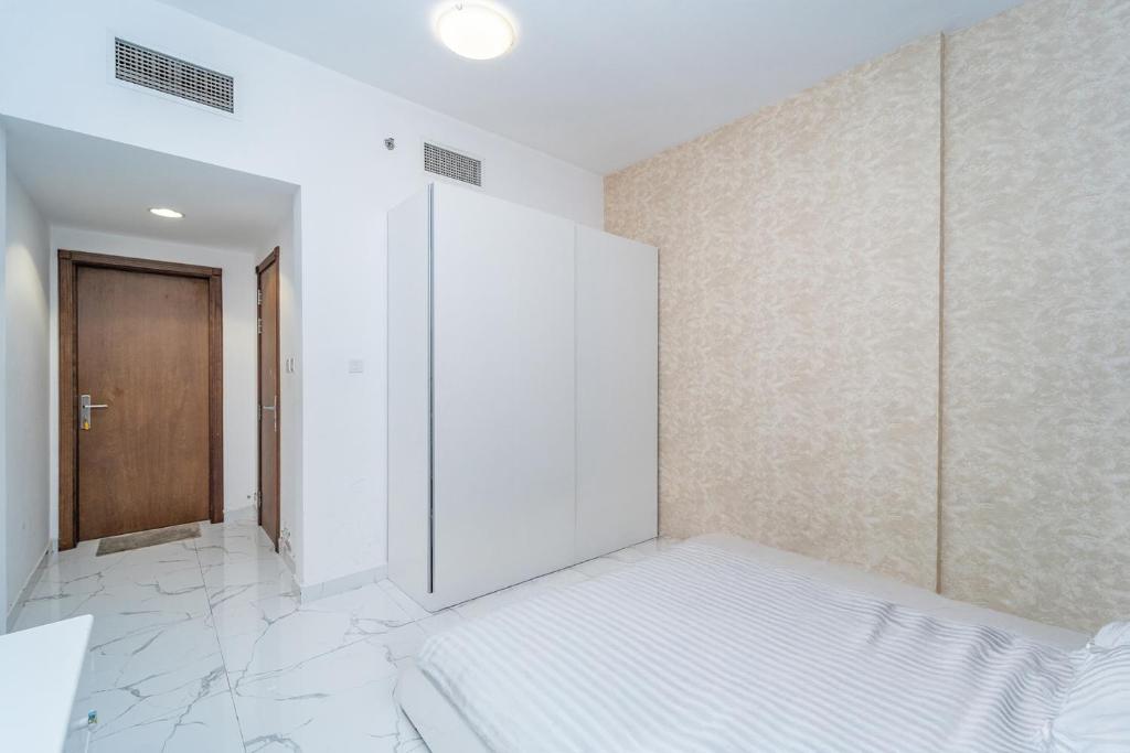 Postel nebo postele na pokoji v ubytování Oasis Tower 1