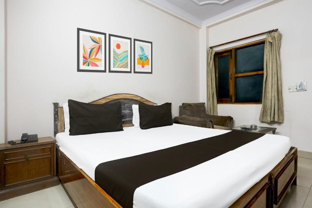 Postel nebo postele na pokoji v ubytování Hotel O Golden