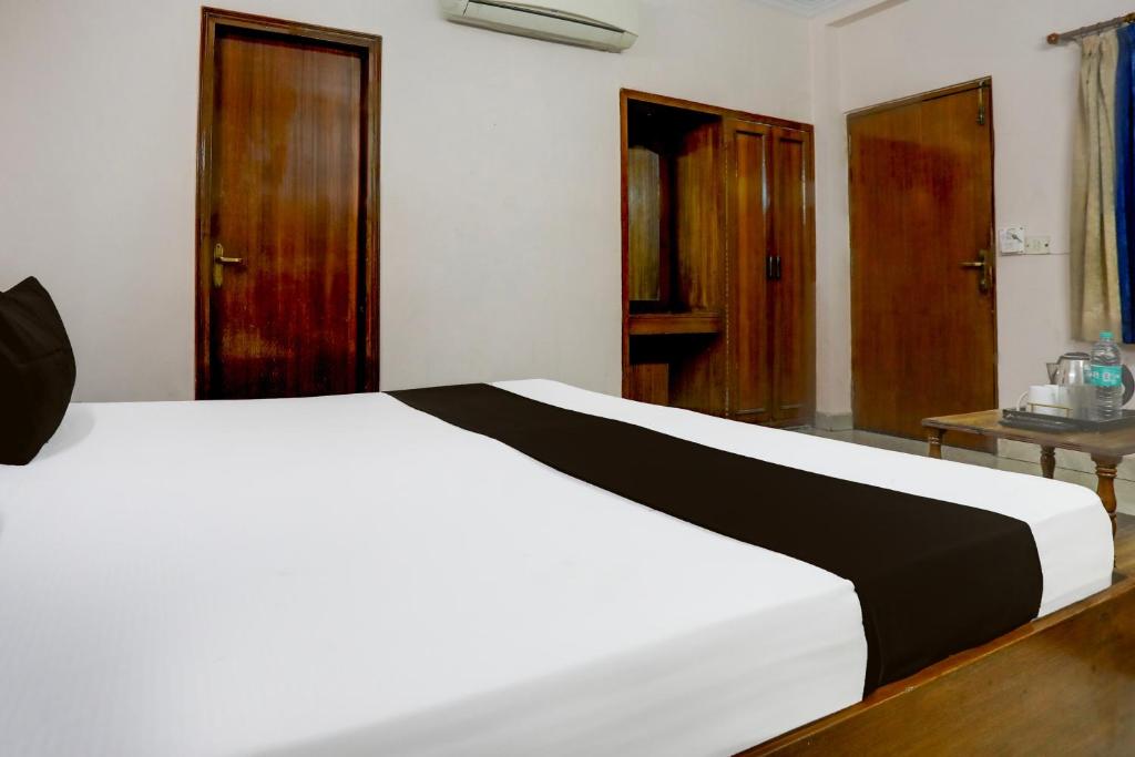 Postel nebo postele na pokoji v ubytování Hotel O Golden
