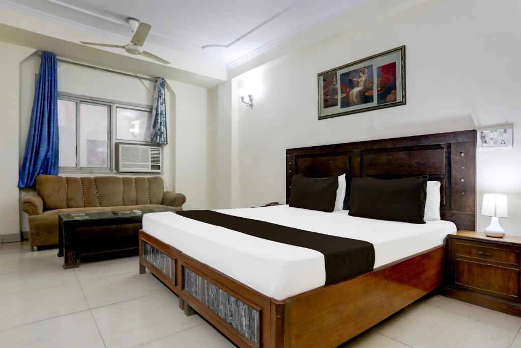 Postel nebo postele na pokoji v ubytování Hotel O Golden