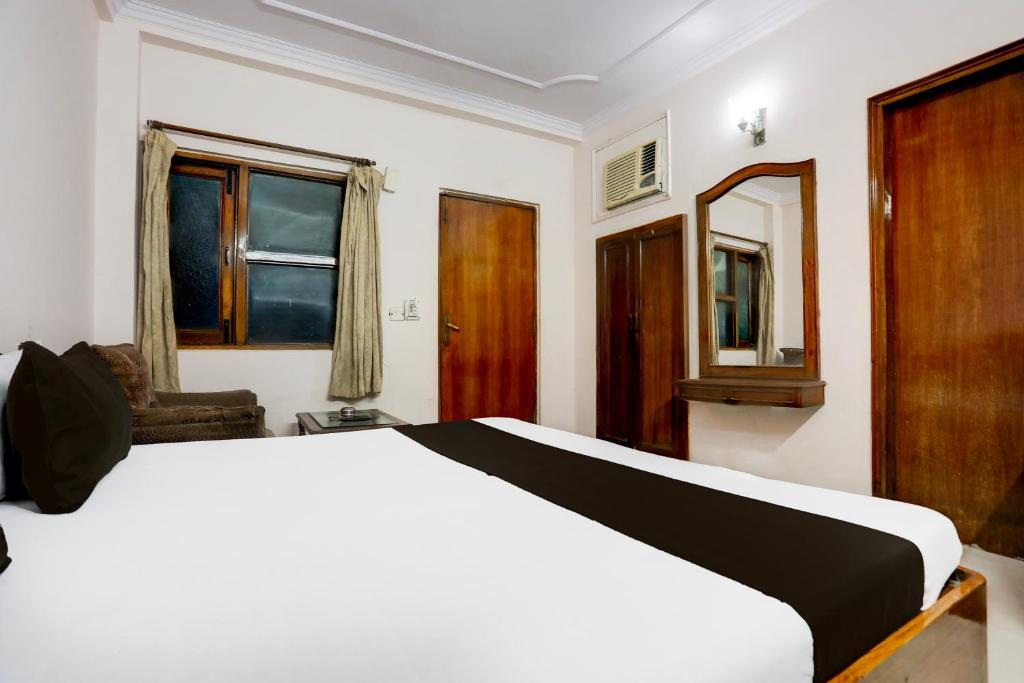Postel nebo postele na pokoji v ubytování Hotel O Golden