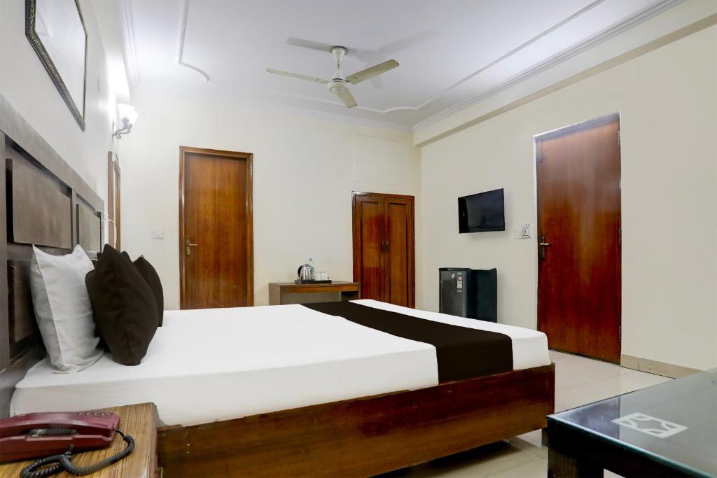 Postel nebo postele na pokoji v ubytování Hotel O Golden