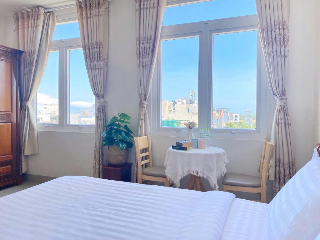 Postel nebo postele na pokoji v ubytování Shiny Homestay Da Nang