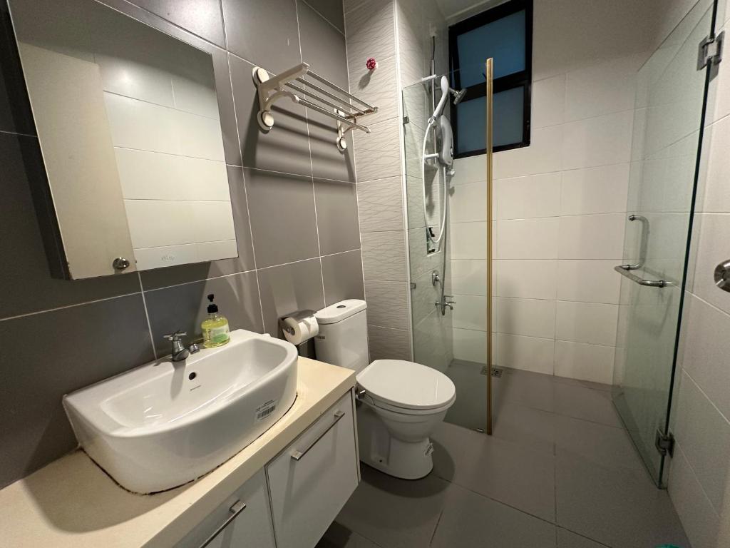 a bathroom with a sink and a toilet and a shower at The Platino 6 to 8pax 2 carpark with Nextflix 5min to Paradigm in Johor Bahru