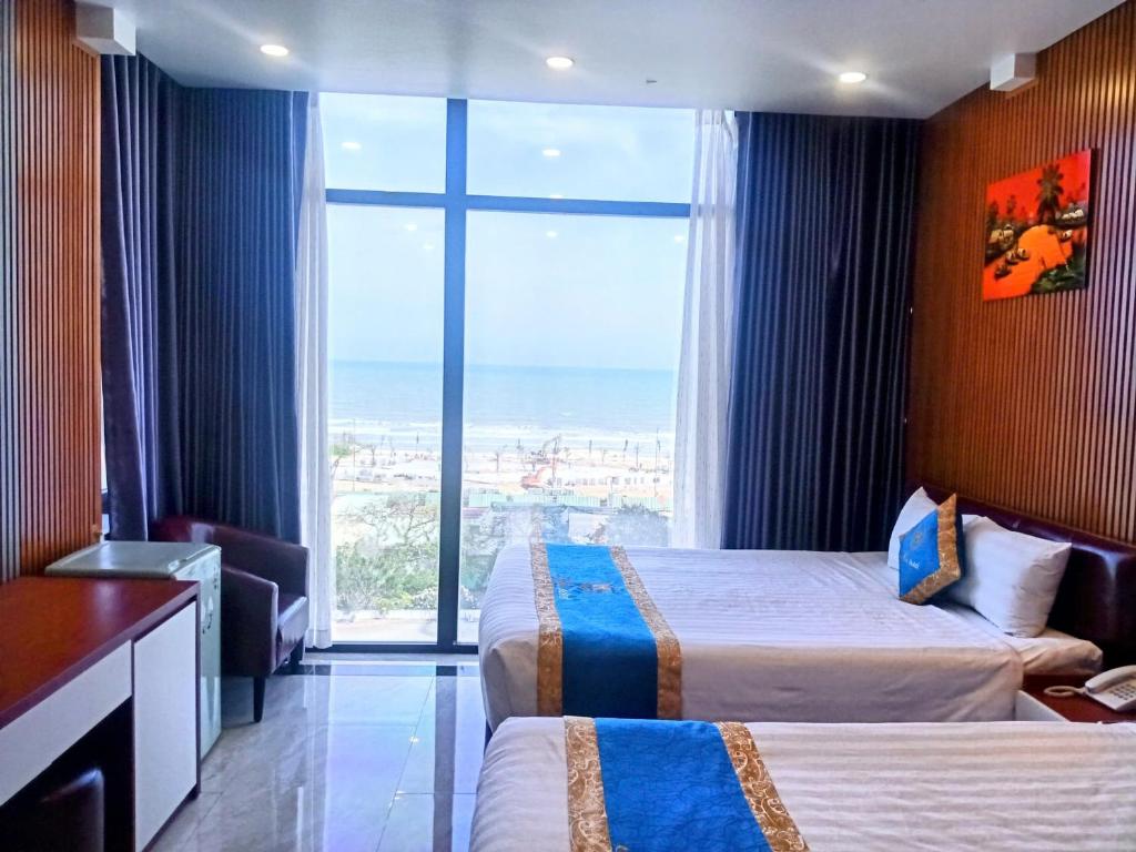 Postel nebo postele na pokoji v ubytování Mia Hotel Vũng Tàu