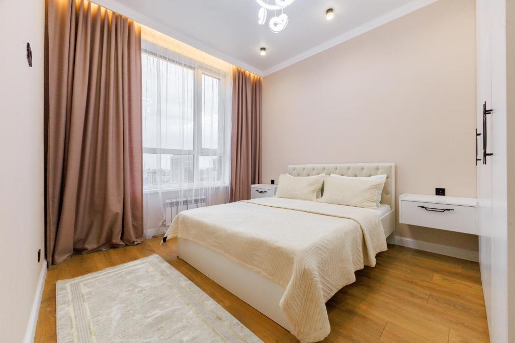 Postel nebo postele na pokoji v ubytování ЖК Respublica