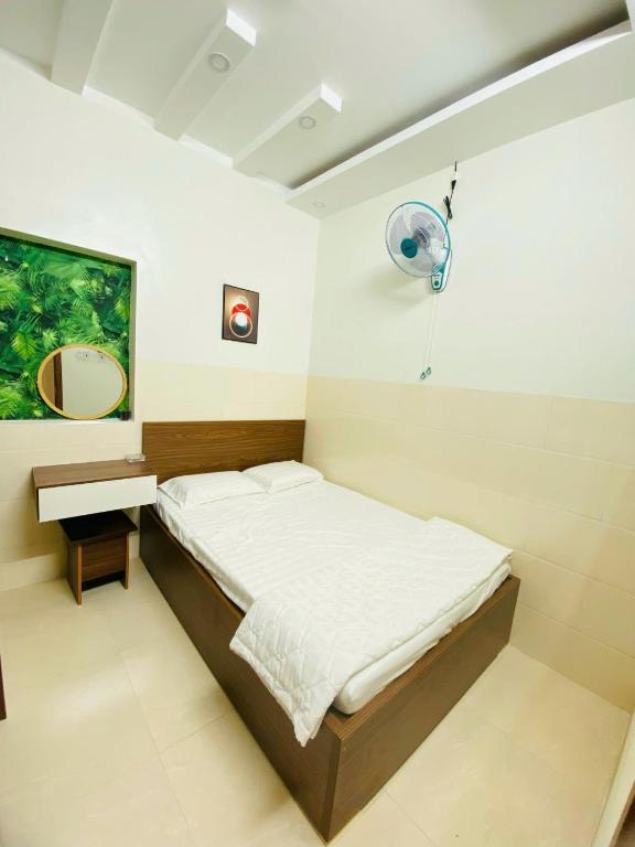 Postel nebo postele na pokoji v ubytování Motel TRUNG HẬU