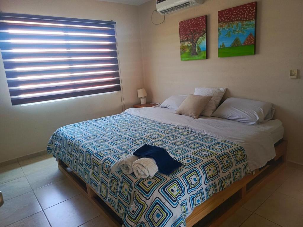 Postel nebo postele na pokoji v ubytování Urbanizacion Privada Ceibo Real