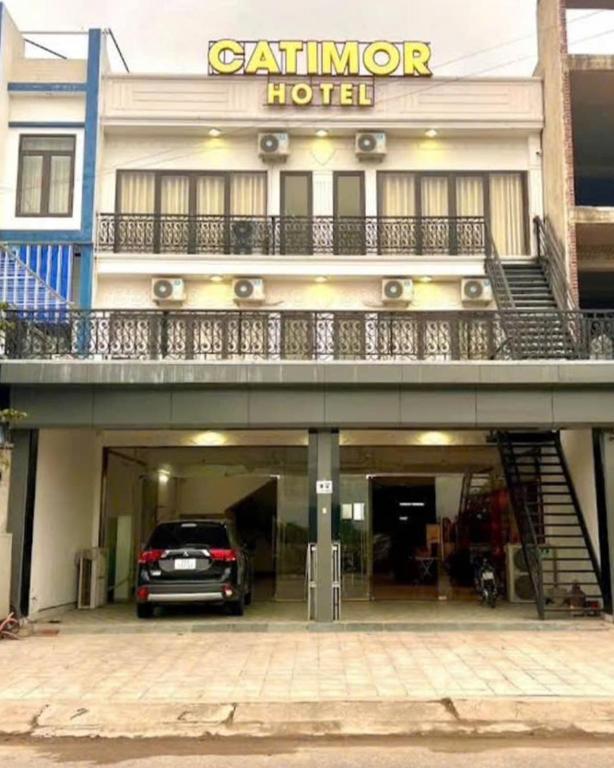 a car parked in front of a hotel at Catimor Hotel in Sầm Sơn