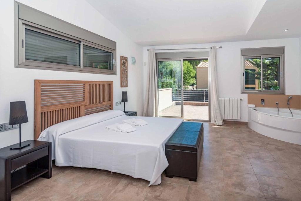 Postel nebo postele na pokoji v ubytování Villa Marioma