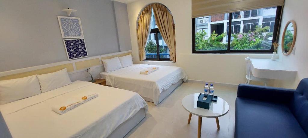 Postel nebo postele na pokoji v ubytování Hue House Stay Gần Aeon Mall Huế