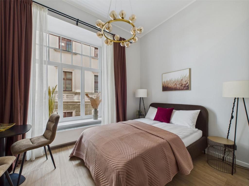 Ένα ή περισσότερα κρεβάτια σε δωμάτιο στο Loft Studio in Heart Old Town Riga