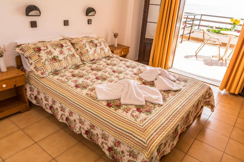 Postel nebo postele na pokoji v ubytování Hotel Sylvia