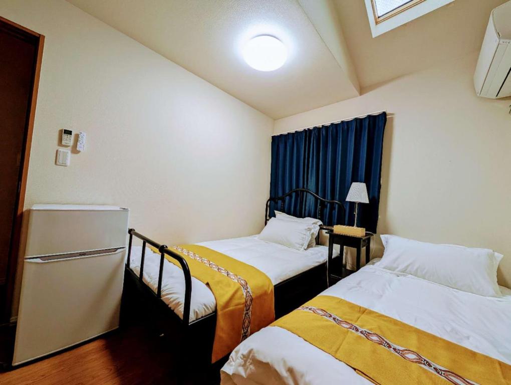 Ένα ή περισσότερα κρεβάτια σε δωμάτιο στο 池袋本町301