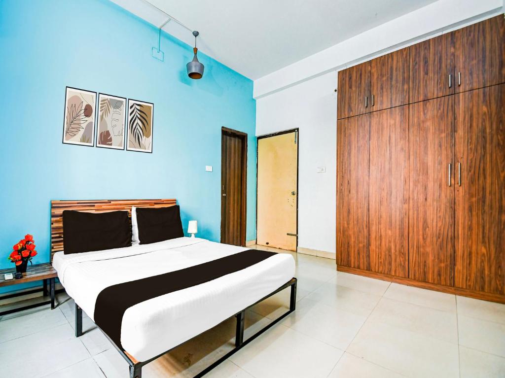 Postel nebo postele na pokoji v ubytování Super Hotel O Kalinganagar