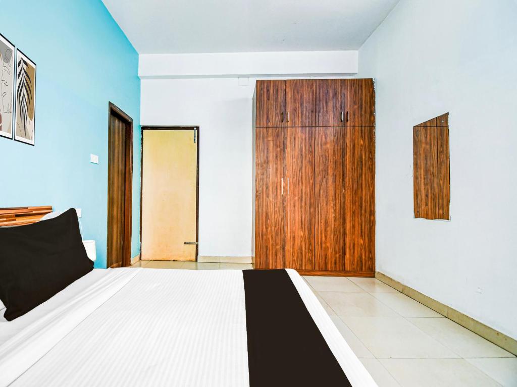 Postel nebo postele na pokoji v ubytování Super Hotel O Kalinganagar