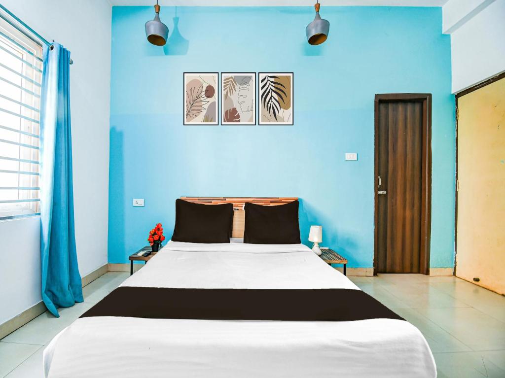 Postel nebo postele na pokoji v ubytování Super Hotel O Kalinganagar