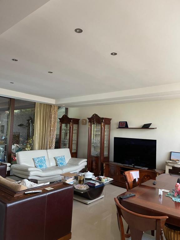 a living room with a couch and a table at Fenix Villa in Noicattaro
