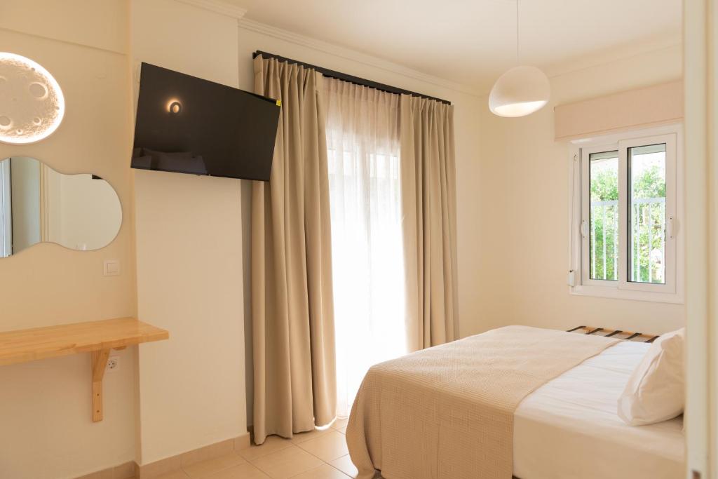Postel nebo postele na pokoji v ubytování Ellinas Hotel