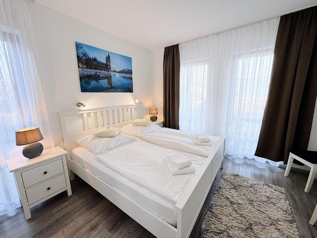 Postel nebo postele na pokoji v ubytování REGIOHOTEL Wittekind Burg