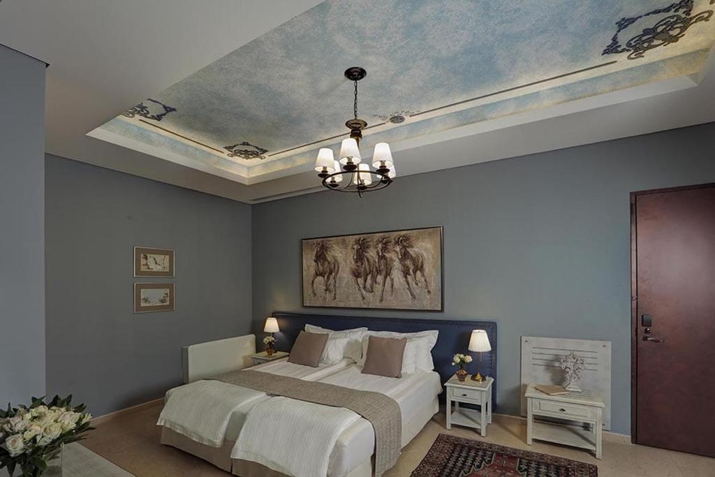 Ένα ή περισσότερα κρεβάτια σε δωμάτιο στο Grand Hotel Bois De Boulogne