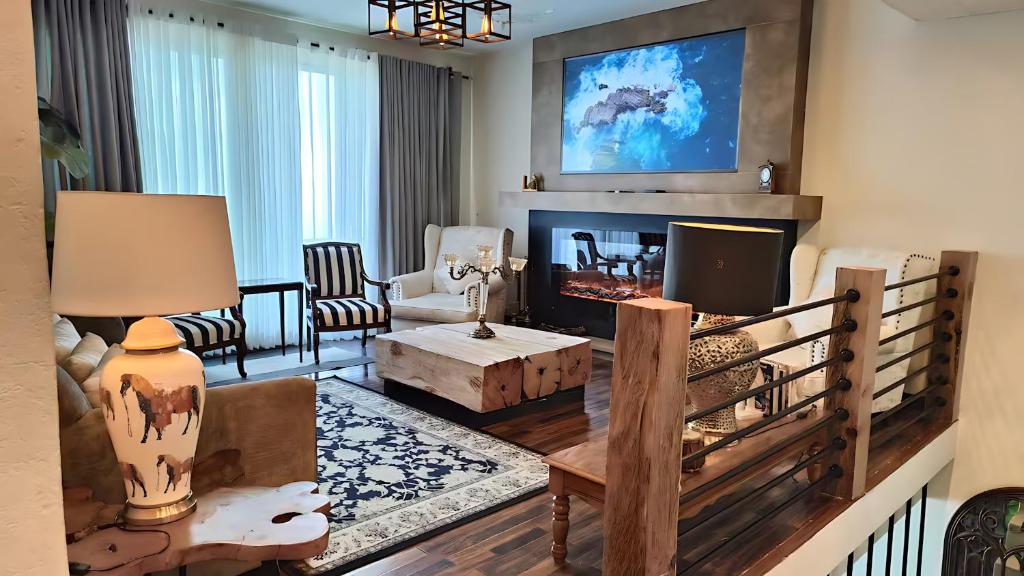 a living room with a couch and a fireplace at Royal Serviced Cottages in Murree