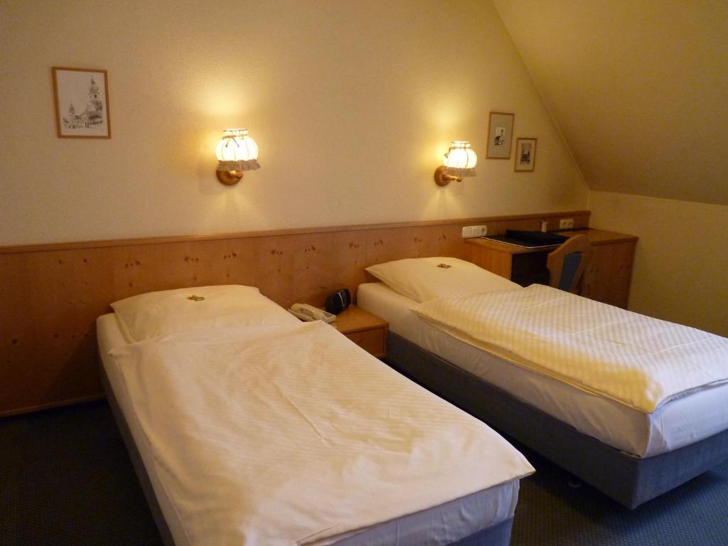 Postel nebo postele na pokoji v ubytování Gasthof zur Schwane