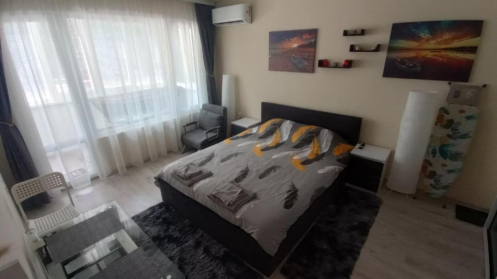 Ένα ή περισσότερα κρεβάτια σε δωμάτιο στο Cosy Apartment