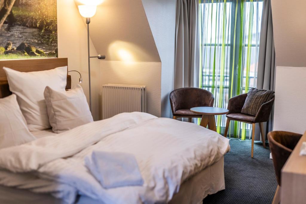 Postel nebo postele na pokoji v ubytování Hotel Birksø