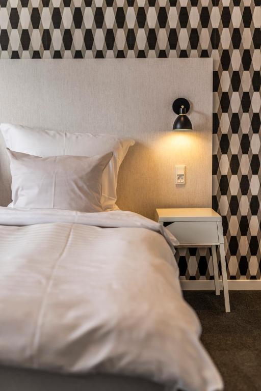 Postel nebo postele na pokoji v ubytování Hotel Birksø