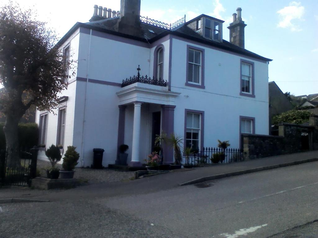 a white house on the side of a street at Braefoot Guest House in Campbeltown
