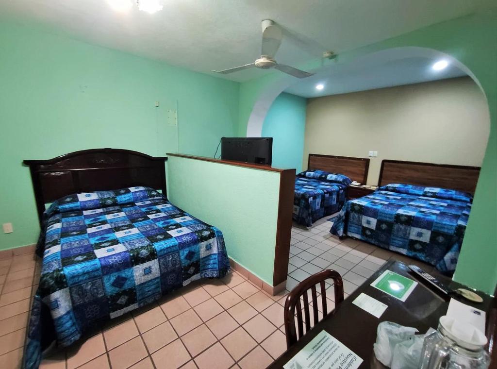 Postel nebo postele na pokoji v ubytování Novotel De Poza Rica