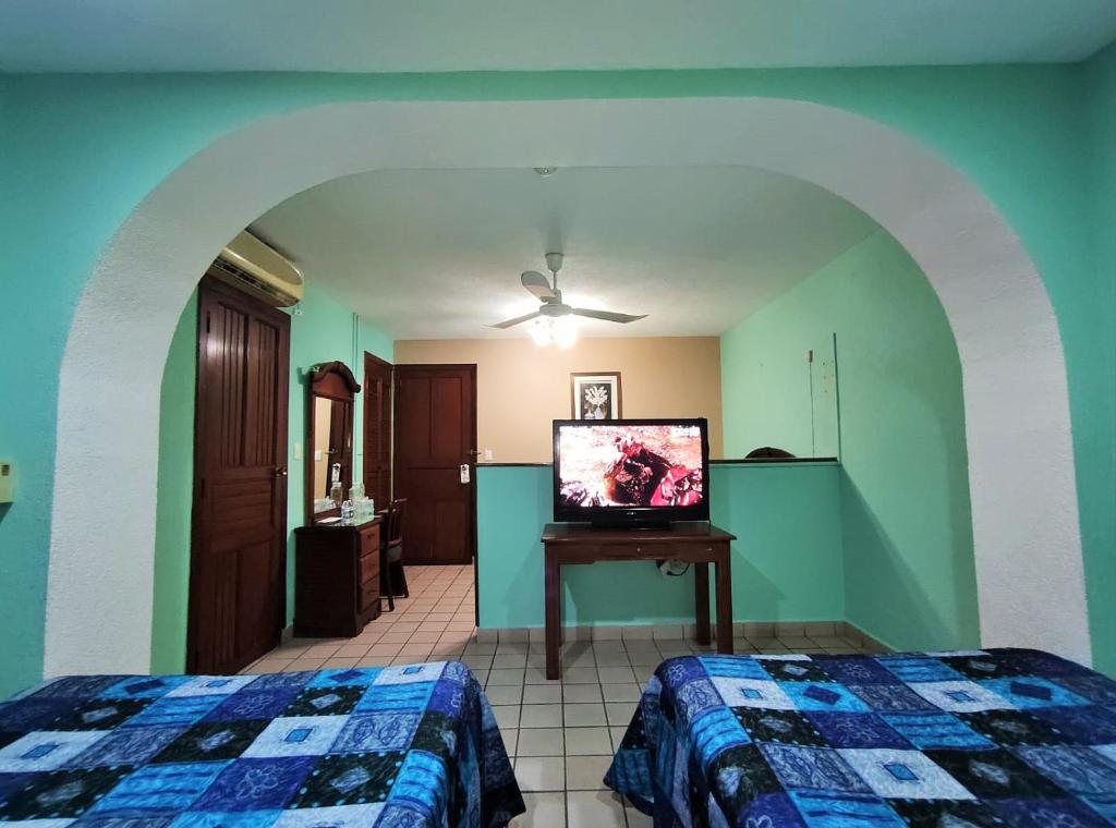 Postel nebo postele na pokoji v ubytování Novotel De Poza Rica