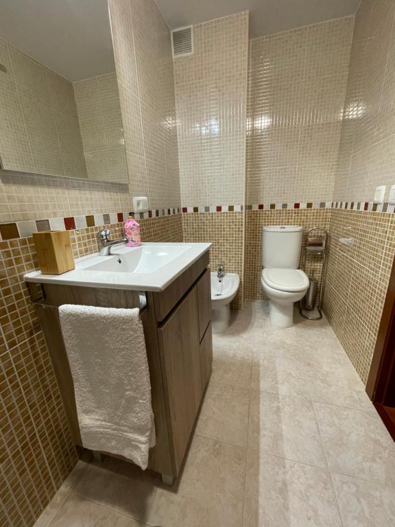 a bathroom with a sink and a toilet at Mar de Covelo in Pontevedra
