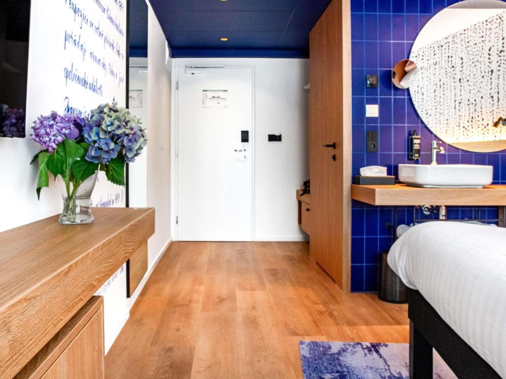 Postel nebo postele na pokoji v ubytování ibis Styles Relax Roznov pod Radhostem