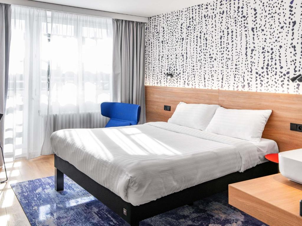 Postel nebo postele na pokoji v ubytování ibis Styles Relax Roznov pod Radhostem