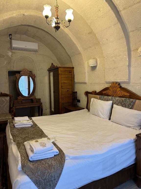 Postel nebo postele na pokoji v ubytování Gamirasu Village House