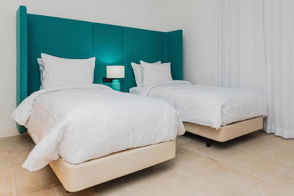 Cama ou camas em um quarto em Radisson Blu Aruba