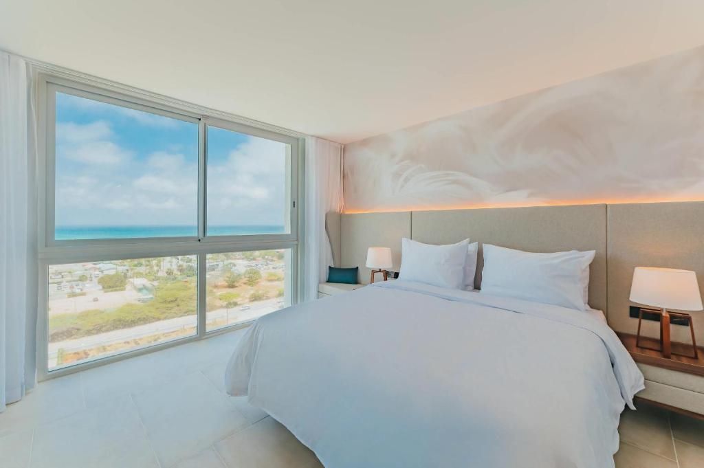 Cama ou camas em um quarto em Radisson Blu Aruba