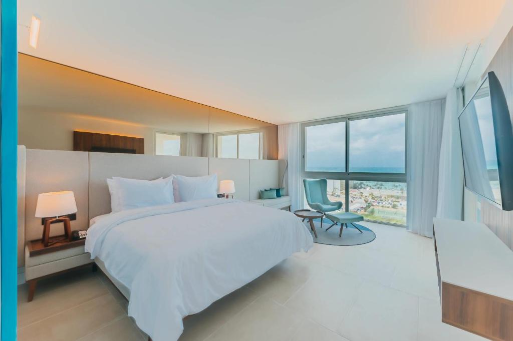 Cama ou camas em um quarto em Radisson Blu Aruba