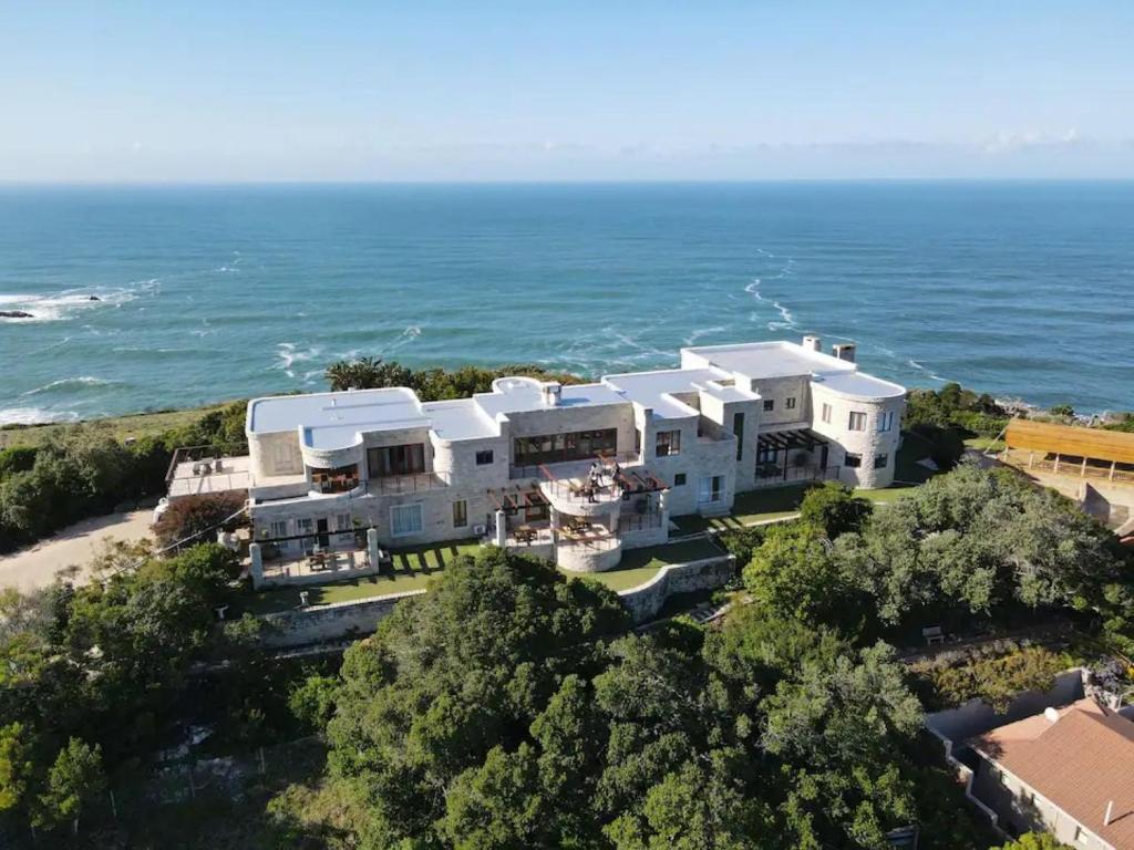 an aerial view of a house on the beach at Castle On The Heads in Knysna