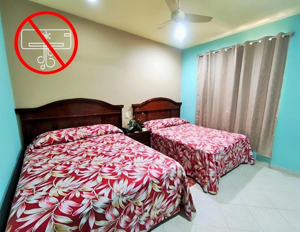Postel nebo postele na pokoji v ubytování Novotel De Poza Rica