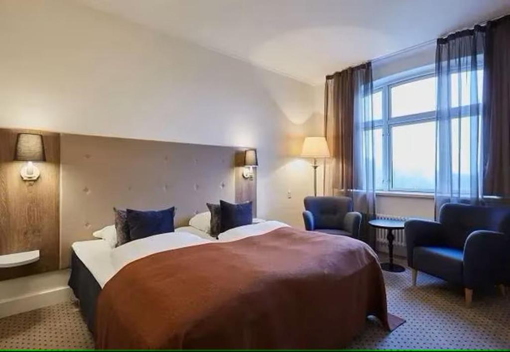 Postel nebo postele na pokoji v ubytování Hotel MDF TELA Near IGI Airport Delhi