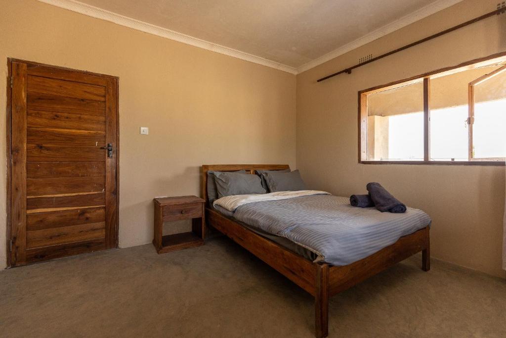 Postel nebo postele na pokoji v ubytování Rain Tree Camp