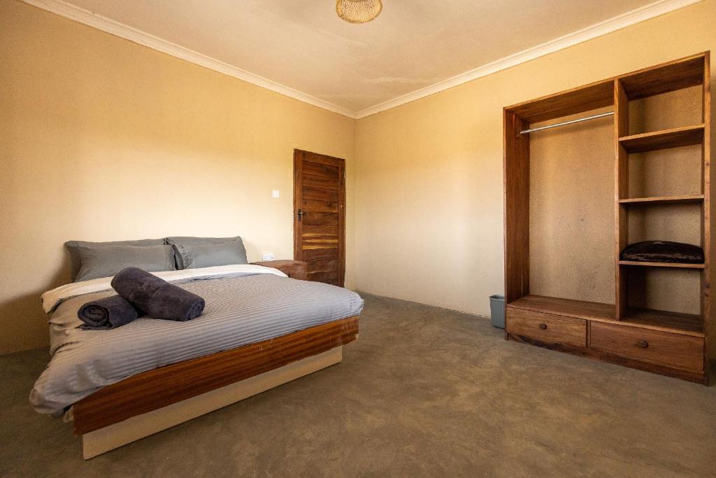 Postel nebo postele na pokoji v ubytování Rain Tree Camp